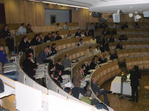 left picture: summary lectures in the auditorium, right picture: postersession with the Advisory Board